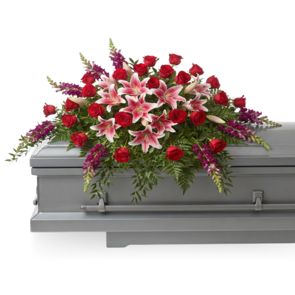 Arrangement of red roses and lilies