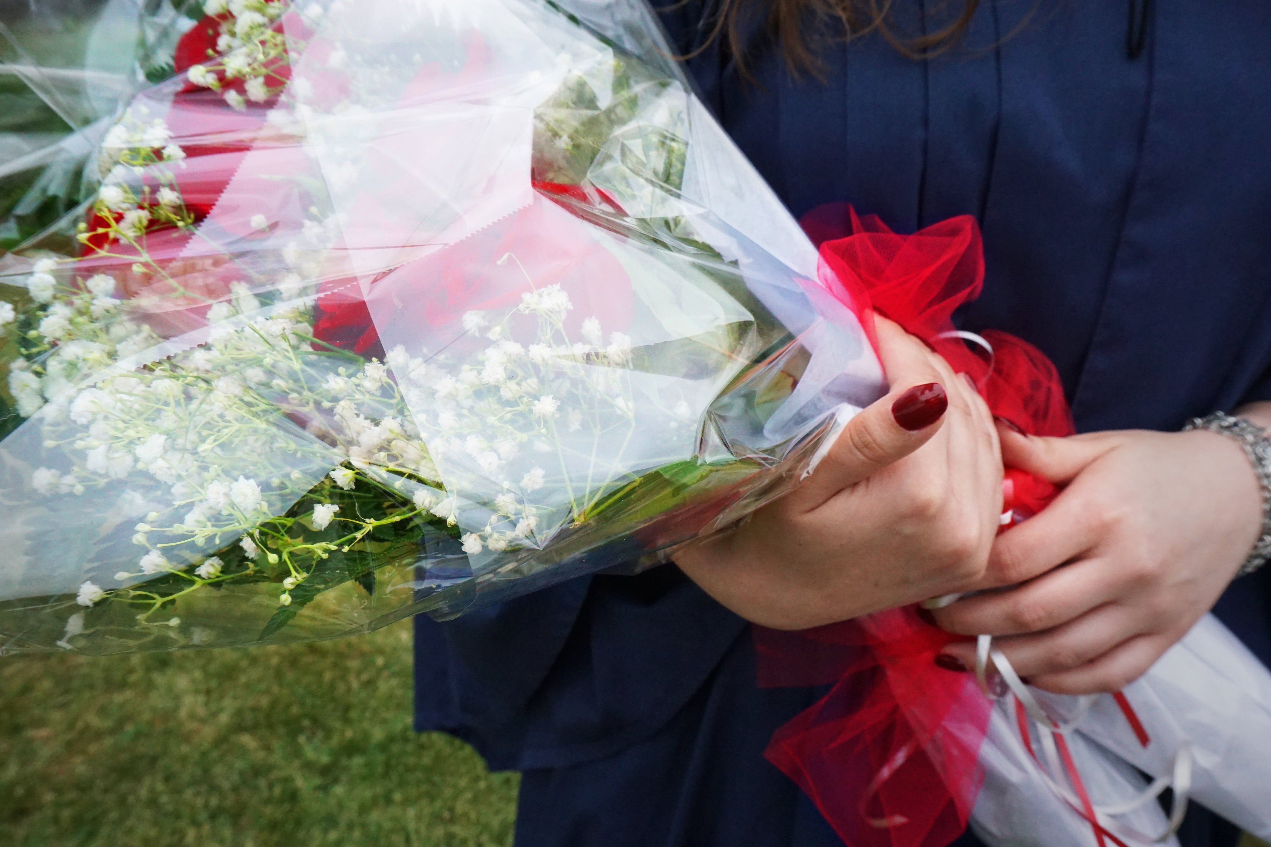 fleut-quebec-graduate-with-bouquet