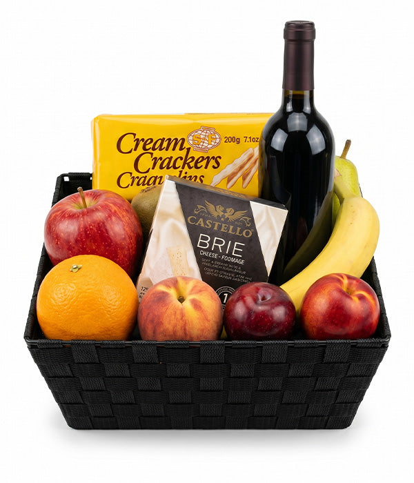 Panier de fruits, vin rouge et fromage
