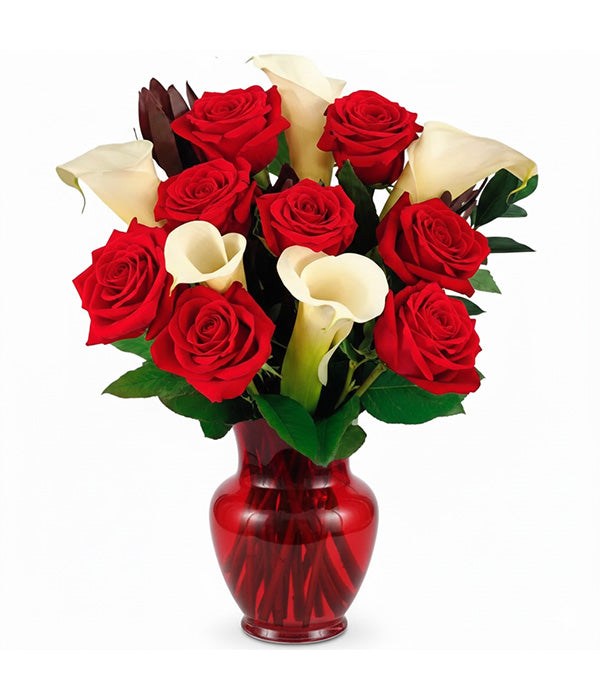 red roses and calla lilies in red vase